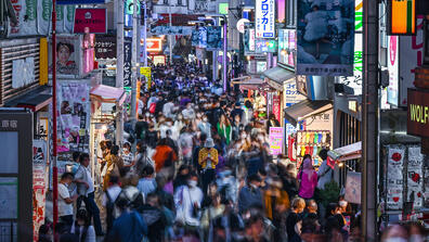 A crowd of people walk down Takeshita Street in the Harajuku area of Tokyo on Oct. 10, 2022