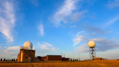 Weather Radar Station in Field under Clear Sky