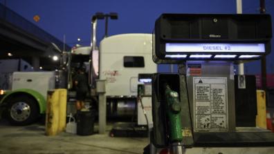 A truck sits parked at a diesel fuel pump in Los Angeles