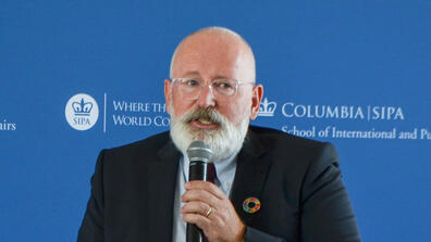 Frans Timmermans is a middle-aged white man, mostly bald, with a gray-white beard and mustache.