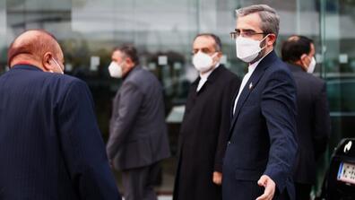 An image of the U.S. and Iran Representatives getting together in Vienna