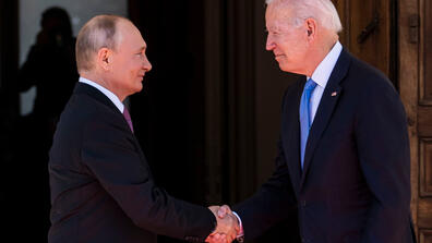 Image of Joe Biden & Vladimir Putin shaking hands