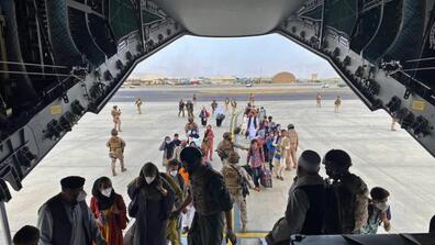 People board a Spanish Airforce A400 plane as part of an evacuation plan at Kabul airport in Afghanistan.