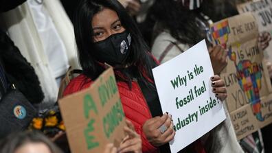 Youth climate activists protested that representatives of the fossil fuel industry were allowed inside the COP26 U.N. Climate Summit in Glasgow.