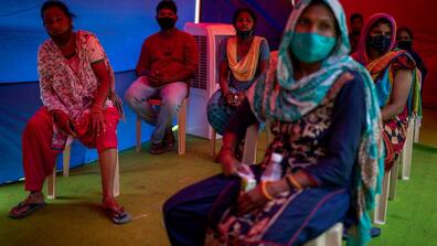 People waited after receiving the Covid vaccine in New Delhi in September 2021.