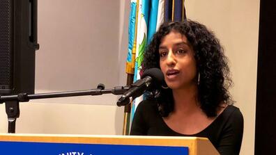 Dipali Mukhopadhyay speaks at a Queens Community 3 meeting