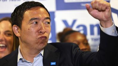 Image of Andrew Yang holding up his fist