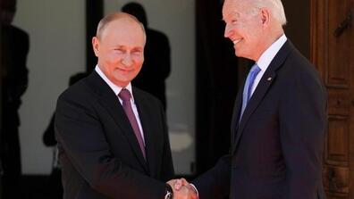 Image of Joe Biden and Vladimir Putin shaking hands