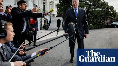 Image of Joe Biden in front of reporters