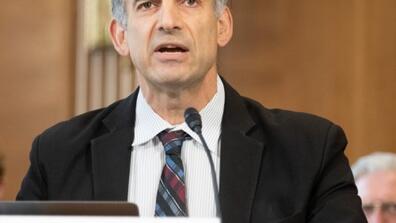 Julio Friedmann speaks at a committee hearing