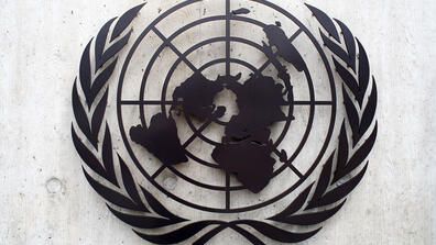 The United Nations emblem is seen in front of the United Nations Office in Geneva on June 8, 2008