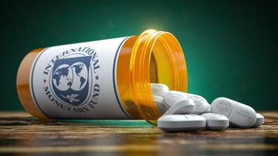A box of pills that says "International Monetary Fund" on the label and "Loan Tranche" on the pills