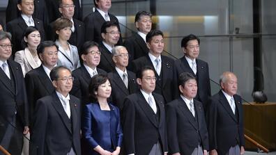 Newly elected Japanese Prime Minister Fumio Kishida, center in first row, with his Cabinet members at the prime minister’s official residence in Tokyo on Oct. 4. 