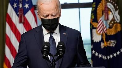 Joe Biden standing at podium
