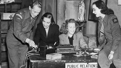 Martha Gellhorn and Virginia Cowles with members of the cast at the opening night of their play Love Goes to Press, 1946, Embassy Theatre, Swiss Cottage, London. Left to right: Ralph Michael, Virginia Cowles, Martha Gellhorn and Irene Worth