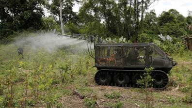 An anti-narcotics police officer tests a tactical vehicle to spray herbicides on a coca crop in Tumaco, in southern Colombia, in April 2018. 
