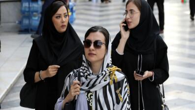 Iranian women walk in the capital, Tehran, on Aug. 27. Iran’s economy has struggled with U.S. sanctions and could face even more after last weekend’s attack on Saudi oil facilities.
