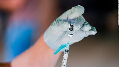 A needle is prepared for a vaccination