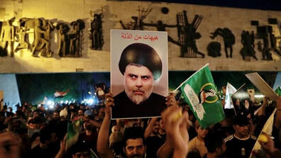 Followers of Shiite cleric Moqtada al-Sadr celebrate after the announcement of the results of parliamentary elections in Baghdad