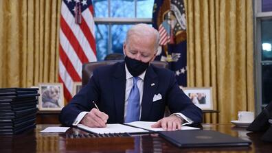 Biden signs executive orders in the oval office