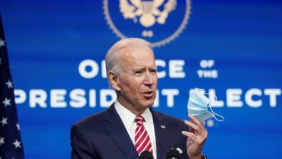 Joe Biden holding a face mask
