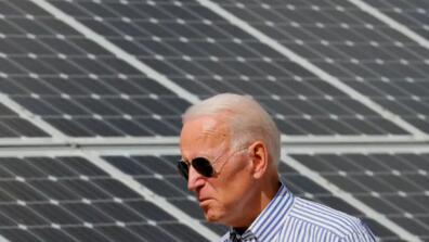 Biden in front of solar panels
