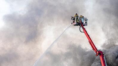 Image of firemen extinguishing a fire from above