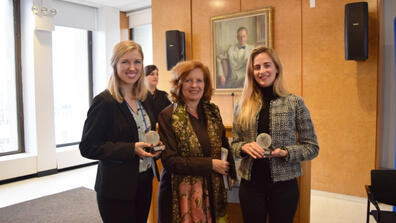 Dean Merit E. Janow (center) is flanked by Shanna Crumley (left) and Gemma Torras Vives, winners of the 2018 GPPN student competition.