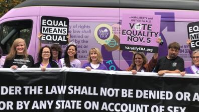 Lisa Sales gathers with organizers of VA Ratify ERA ahead of a parade in Sterling, Va., to advocate for the passage of the Equal Rights Amendment.