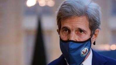 John Kerry wearing a face mask
