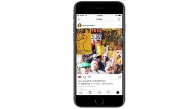 an iphone screen displays an instagram post of a photo of a labor protest