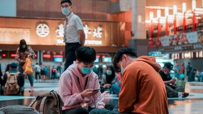 people wearing masks at Taipei main station