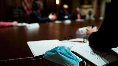 a mask sits on a desk