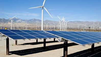 A solar farm with wind turbines