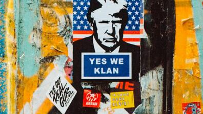 a poster has an illustration of president Trump and reads "yes we klan"