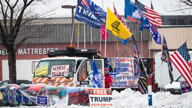 Signs in support of Trump adorn a truck