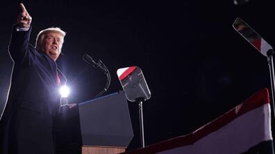 Trump gives a speech at a podium