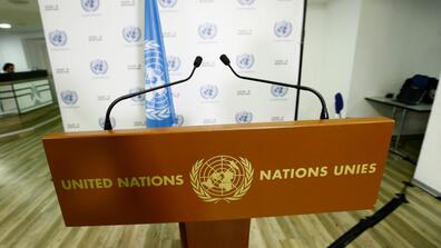A podium with the United Nations logo on it