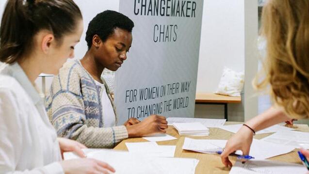 Employees working at table