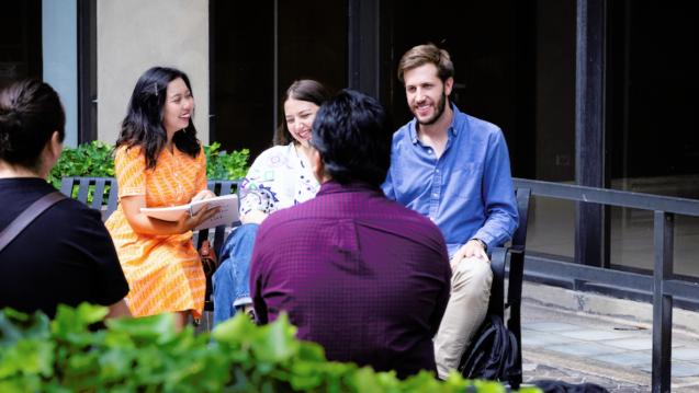 students talking outside