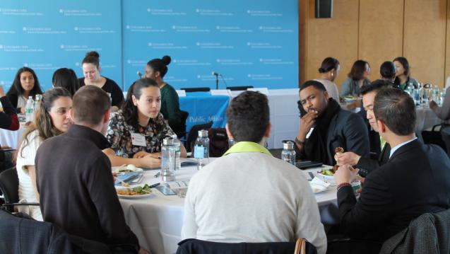 MPA-ESP Students sitting at round tables at an event 