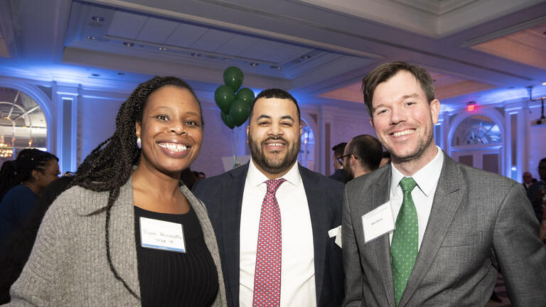 Three Alumni at a networking event