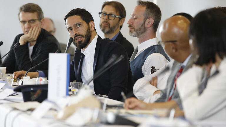 Speakers at a table