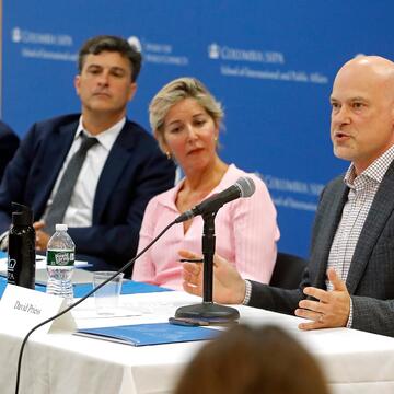 people speaking on a panel