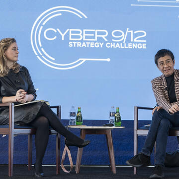 Camille François MIA '13 and Maria Ressa on stage