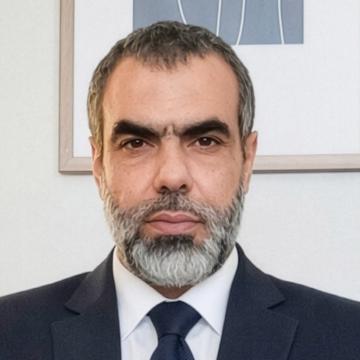 Headshot of Jaser Abu Mousa wearing a suit and tie.