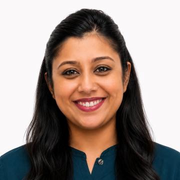 SIPA Adjunct Assistant Professor Tusharika Deka smiling and wearing a dark blue top.