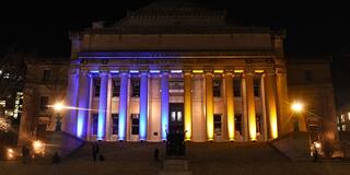 Through the month of March 2022, Low Library was illuminated in the colors of the Ukrainian flag, marking the university's support for the Ukrainian people in the face of the ongoing invasion of their country by Russian forces. (Photo by Eileen Barroso)
