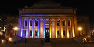 Through the month of March 2022, Low Library was illuminated in the colors of the Ukrainian flag, marking the university's support for the Ukrainian people in the face of the ongoing invasion of their country by Russian forces. (Photo by Eileen Barroso)