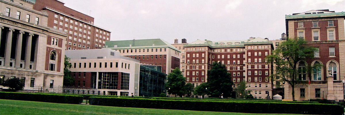 South lawn with buildings and sky. 